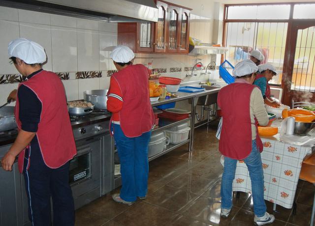 Cooking in OSA House kitchen in Collique, Peru