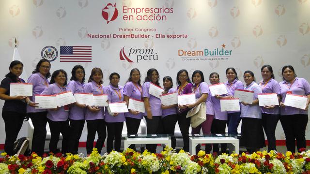 Women show certificates at DreamBuilder ceremony in Collique, Peru